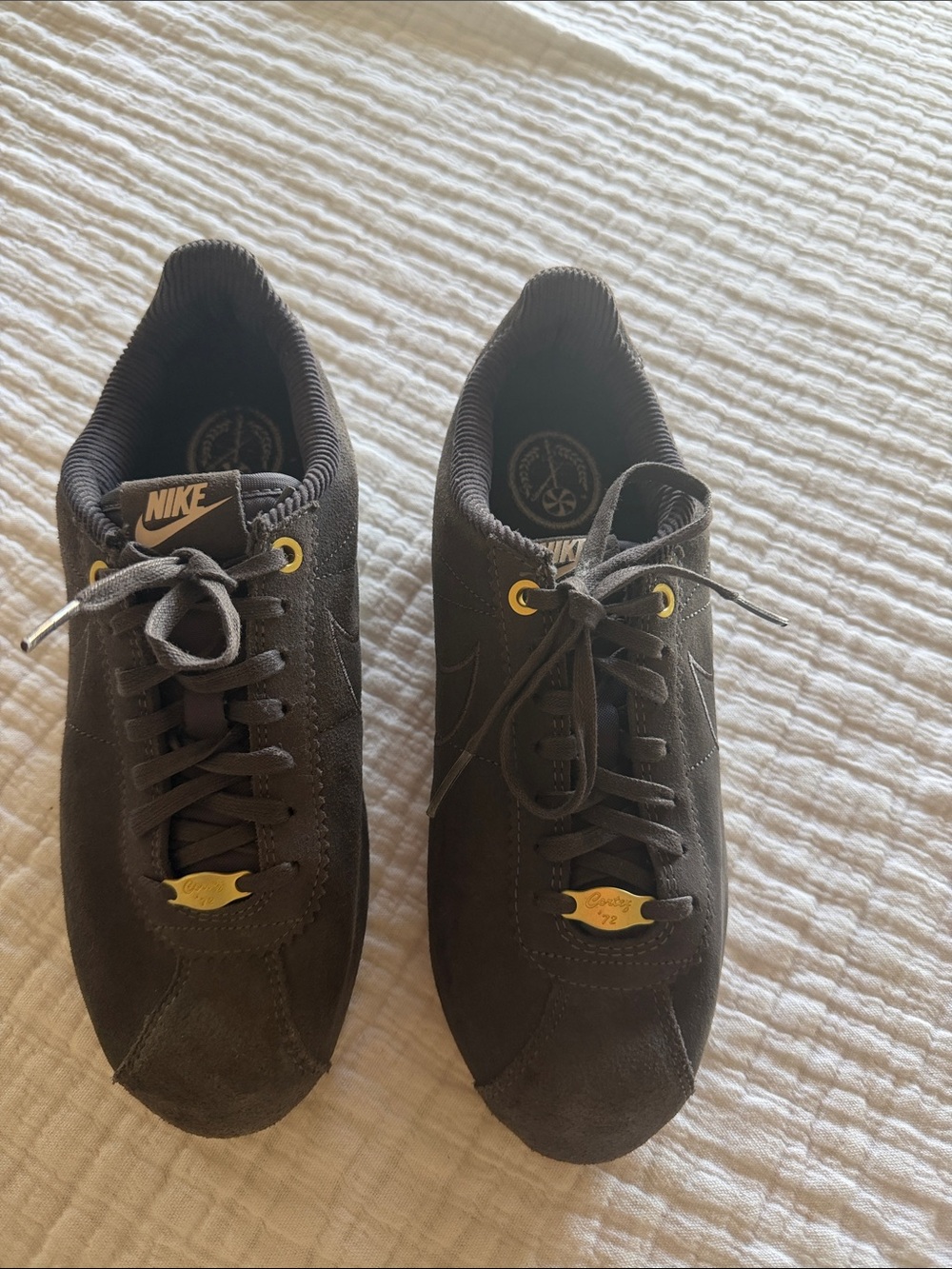 Nike women’s grey Suede Sneakers with Gold Accents